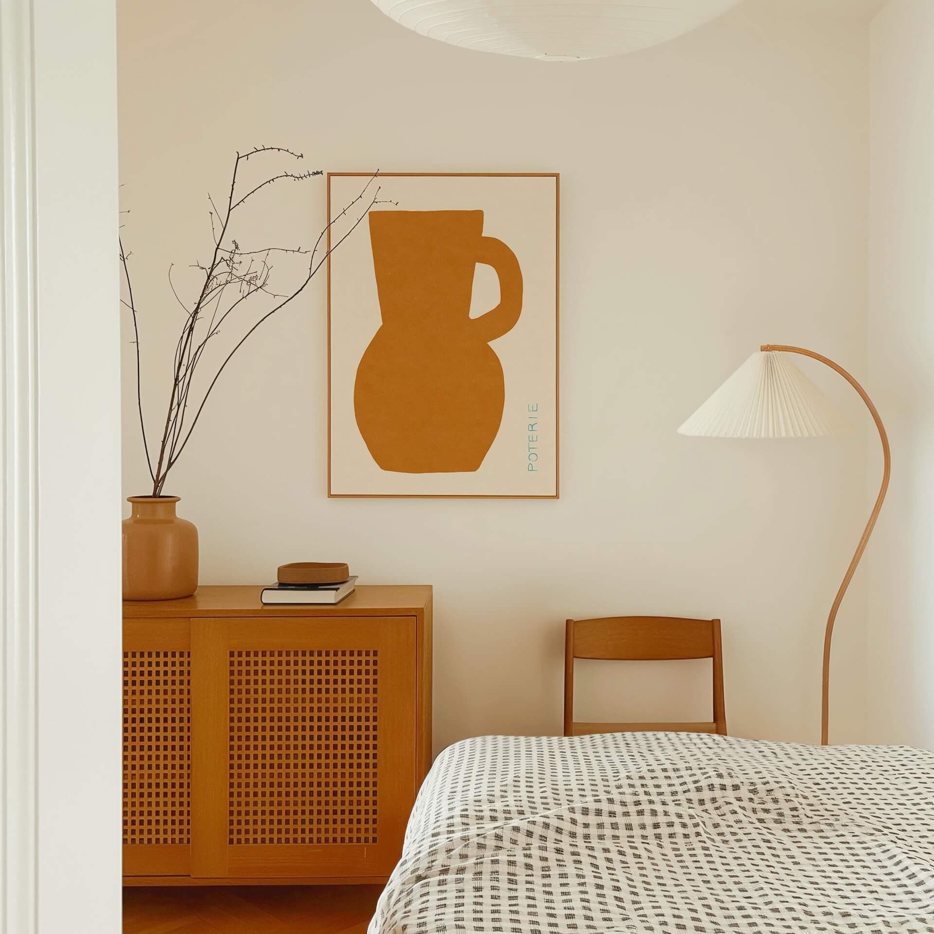 french pottery fine art print in mediterranean bedroom in thin wood frame on plaster pink wall