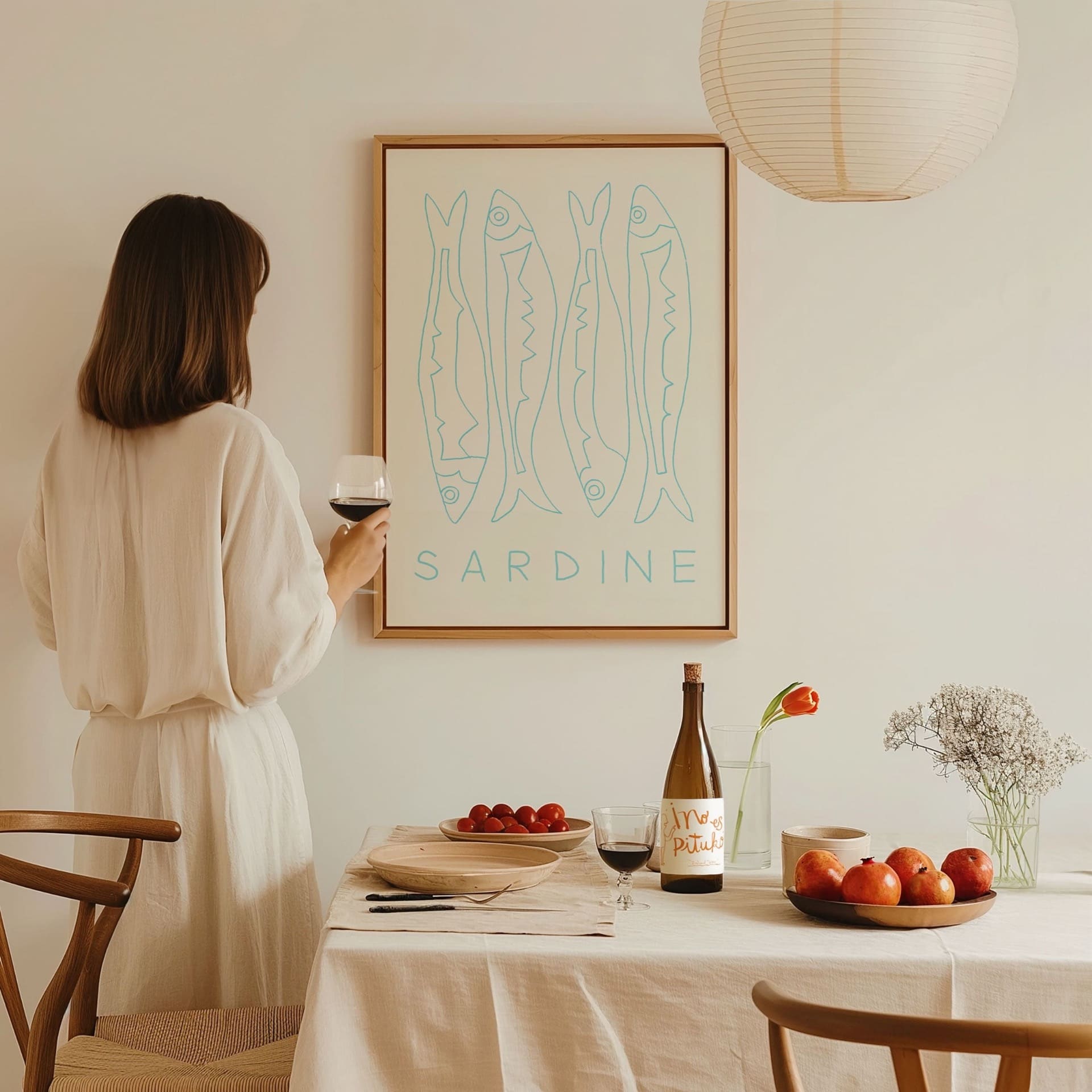 sardine fish art print in large floating frame in dining room by wine