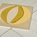 Green, cream, yellow painting of summer beach ball on reinforced plywood panel by contemporary Cornwall Artist Mila May.