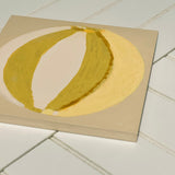 Green, cream, yellow painting of summer beach ball on reinforced plywood panel by contemporary Cornwall Artist Mila May.