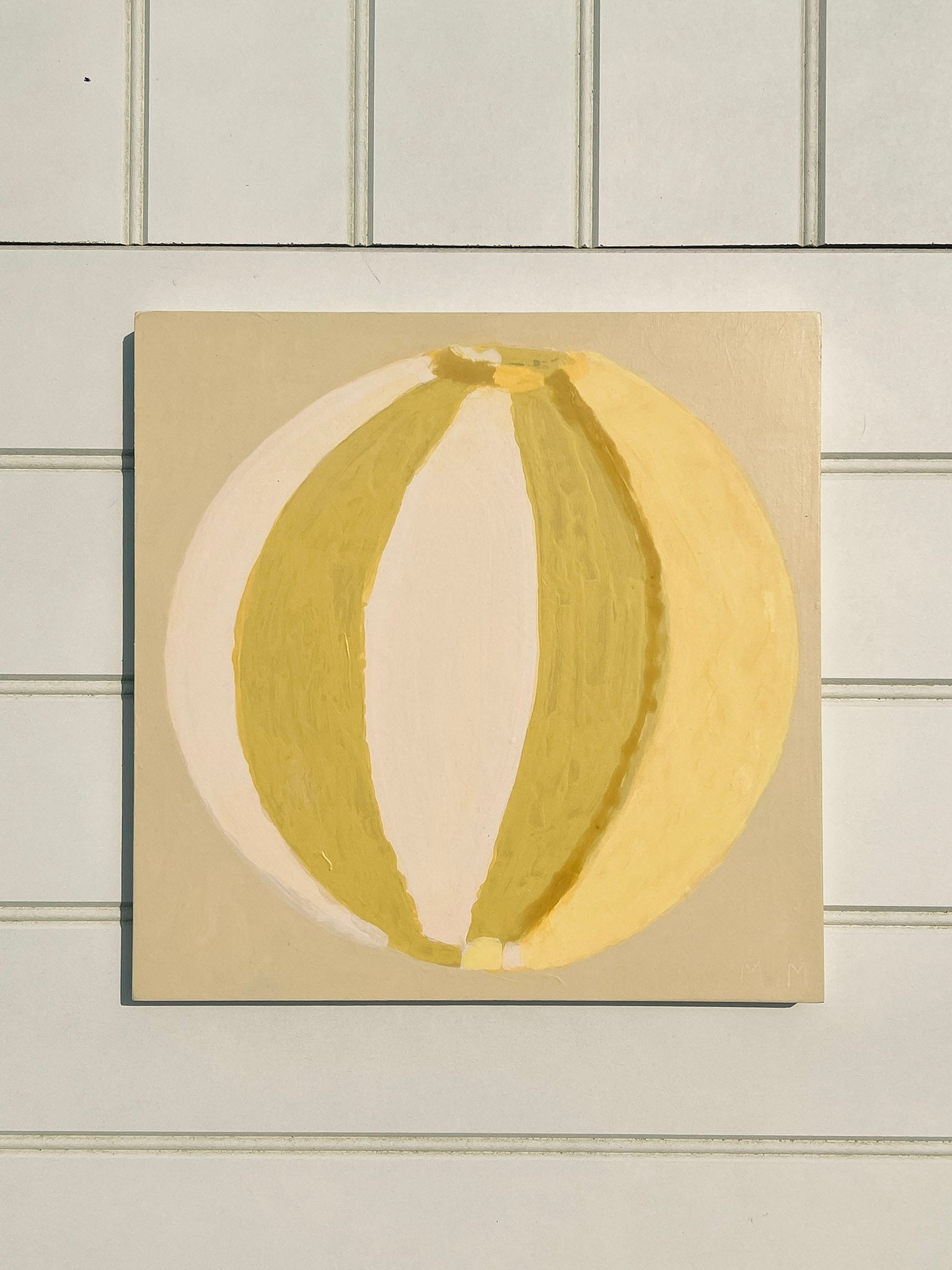 Green, cream, yellow abstract painting of summer beach ball on reinforced plywood panel by contemporary Cornwall Artist Mila May.