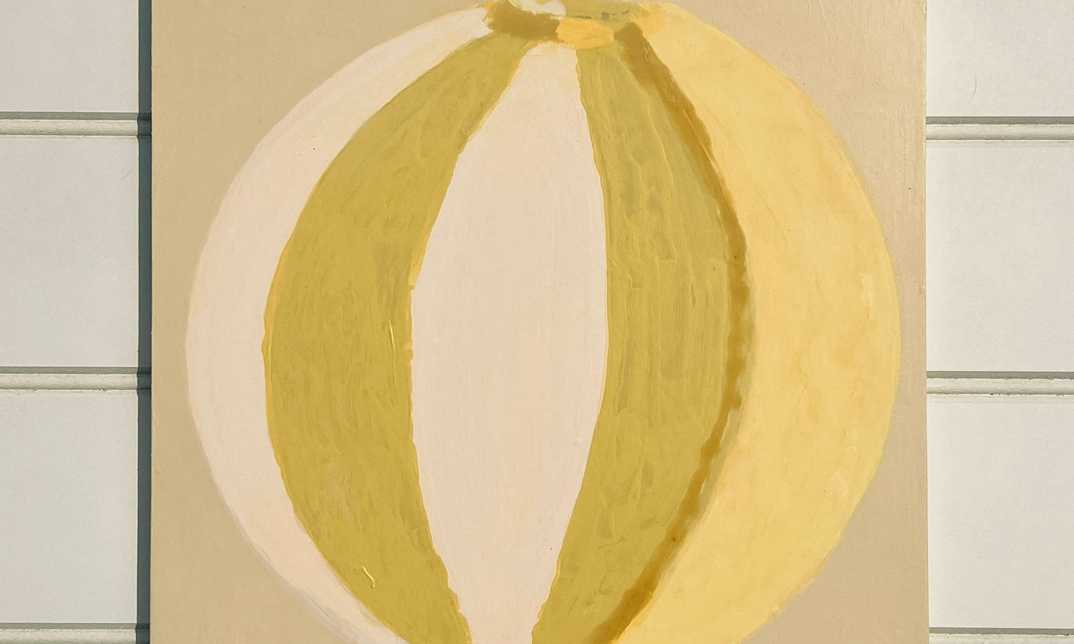 Green, cream, yellow abstract painting of summer beach ball on reinforced plywood panel by contemporary Cornwall Artist Mila May.