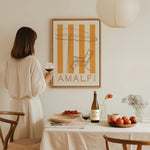 women drinking red wine in dining room with tomatoes and amalfi art print