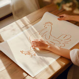 french hen giclee art print on pine wood plank table in woman hands