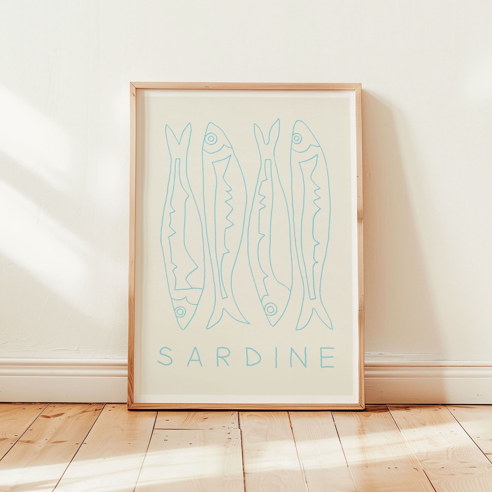 sardine fish art print with white mount in pine wood frame in sunny room